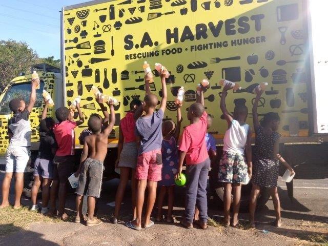 Children receiving nutritious juices from SA Harvest’s donations